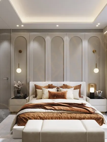 A bedroom design featuring an arched wall motif and warm, earthy tones, creating a cozy and sophisticated atmosphere.