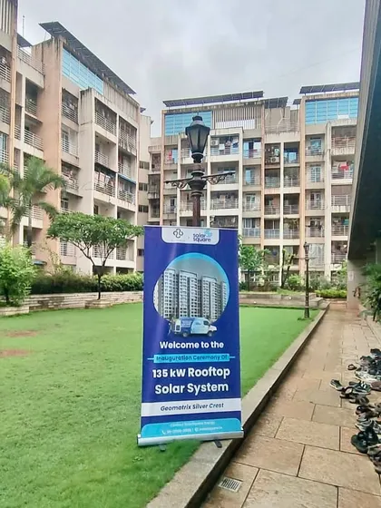 A welcome banner for the 135 kW Rooftop Solar System inauguration at Silver Crest Housing Society in Navi Mumbai.