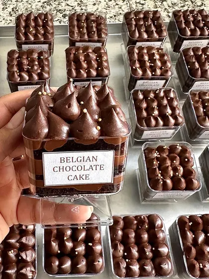 This image showcases a bulk delivery of my Belgian Chocolate Cake tubs. Each individual portion is rich, decadent, and beautifully presented, making it an ideal choice for corporate events or employee appreciation gifts.