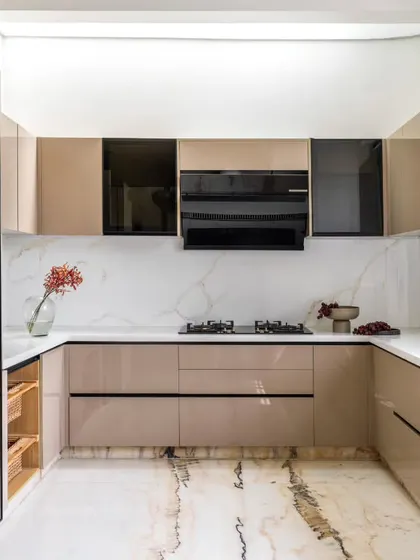 The kitchen is the heart of the home, and in the Avani Residence, we designed it to be bright, airy, and seamlessly connected to the dining area. High-gloss finishes, a marble backsplash, and a skylight ensure the space is always filled with light and positive energy.