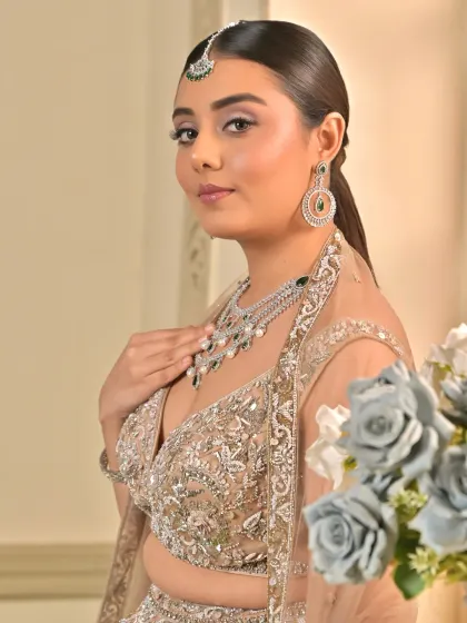 This side profile highlights the flawless base and the subtle contouring that defines her features. The look exudes grace and opulence, perfect for a sangeet night.