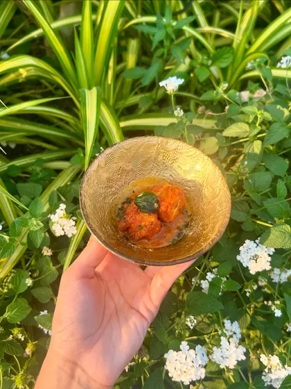 Gunpowder Cottage Cheese served in a Rasam Broth, a South Indian-inspired appetizer with a spicy kick.