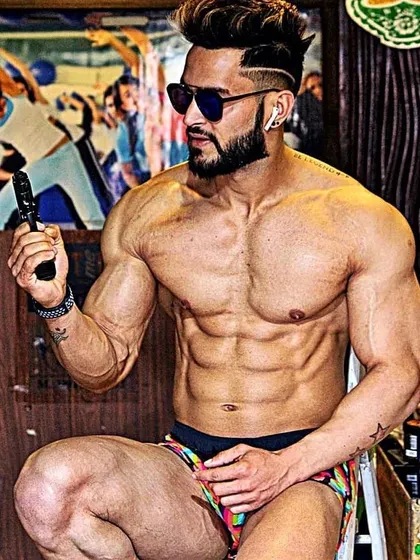A candid shot showing a well-conditioned physique. Fitness is not just a hobby; it's a lifestyle that shows in everything you do.
