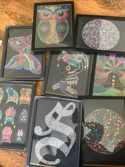 A collection of my framed artworks, featuring owls, floral patterns, and abstract designs. This shows how different pieces can come together to create a beautiful gallery wall.