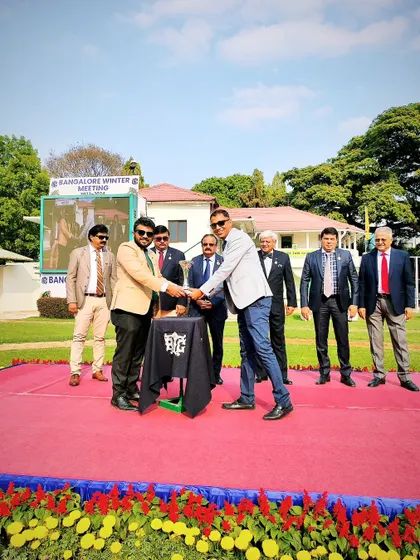 The Sir Charles Todhunter Memorial Trophy is presented to the winning connections.