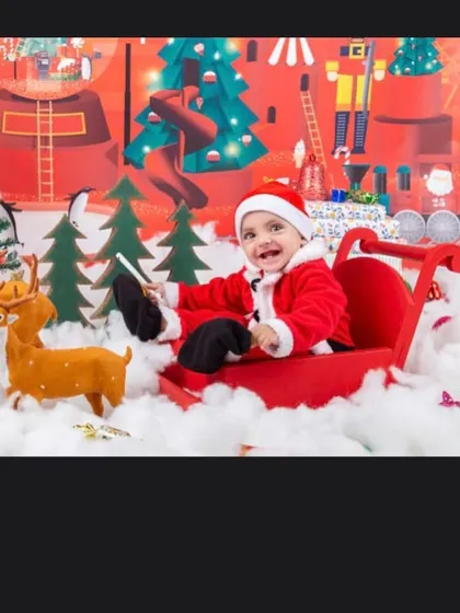 The happiest little Santa's helper, enjoying a sleigh ride through a winter wonderland.