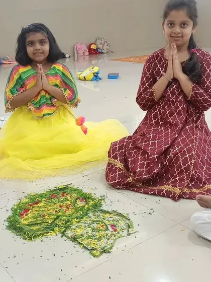 Look at these sweet faces and their lovely floral creation! Our summer camp activities, like Pookalam making, are designed to be fun, engaging, and a celebration of our culture.