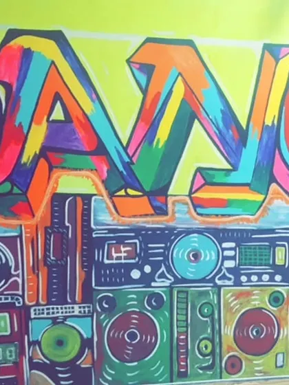 A close-up of the vibrant "DANCE" graffiti that defines our studio's atmosphere. It's a daily reminder to take more chances and dance more dances.