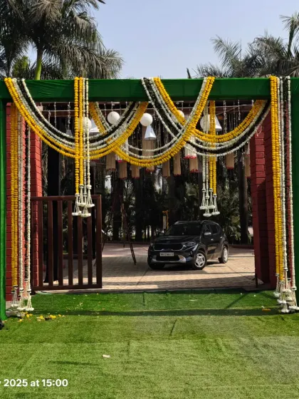 A grand entrance gate for a Haldi ceremony, decorated with marigold garlands and traditional motifs. This sets a festive tone for the event right from the start.