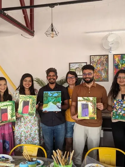 A group of happy participants showing off their finished floral door paintings. The variety in their styles is wonderful to see.