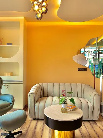 The cozy corner of our private training room, featuring warm colors and comfortable furnishings. It's a space designed to make you feel relaxed and at home.