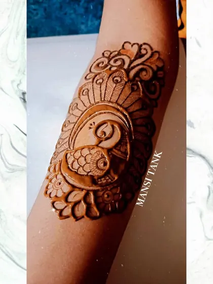 Another one of my peacock designs, this time as a standalone piece on the arm. The intricate feather details and shading make it a beautiful piece of body art.