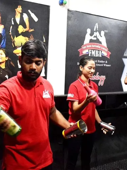 A group of students in red uniforms during a hands-on flair practice session. Everyone gets their own equipment to learn and master the techniques together.