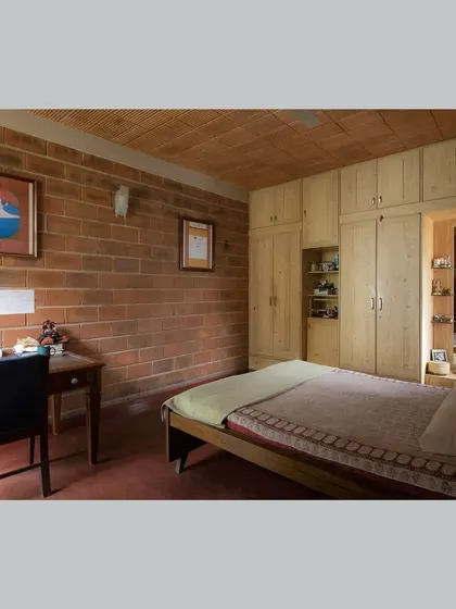 A duplicate of the first bedroom, showing the simple, clean lines of the furniture.