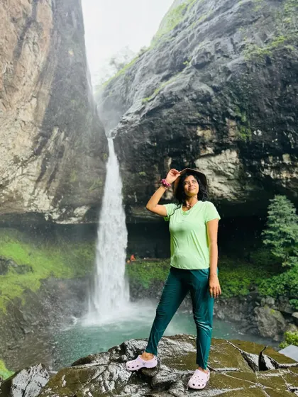 Posing in front of Devkund waterfall. This trek is a favourite for many, and it's easy to see why.