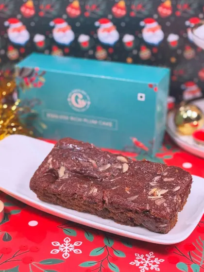 Our Eggless Rich Plum Cake is a holiday essential. It's packed with soaked fruits and spices, making it the perfect dense and flavorful Christmas treat.