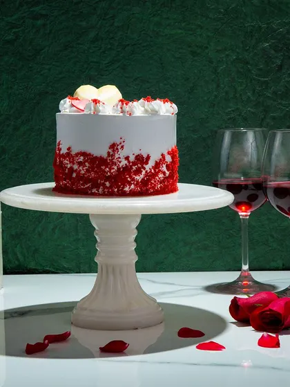 We celebrate love with our heart-shaped red velvet cake. The rich, crimson layers and classic cream cheese frosting are a timeless combination, making this a perfect and romantic choice for an anniversary or Valentine's Day.