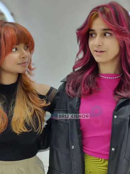 Two stunning Y2K-inspired looks. One with fiery orange and blonde, the other with bold pink. This is imagination running wild with color.