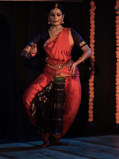The dancer's perfect form and control, a testament to her rigorous training.