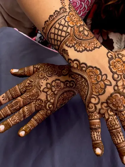 Another angle of this beautiful floral design, showing how the pattern flows from the wrist to the fingers. A great choice for a guest or bridesmaid.