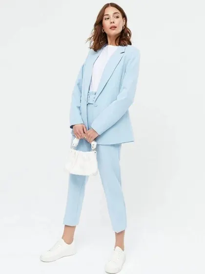 This light blue pant suit shows how you can style my pieces for a more relaxed, smart-casual look. Paired with a simple t-shirt and sneakers, it’s an effortlessly chic outfit for women on the go.