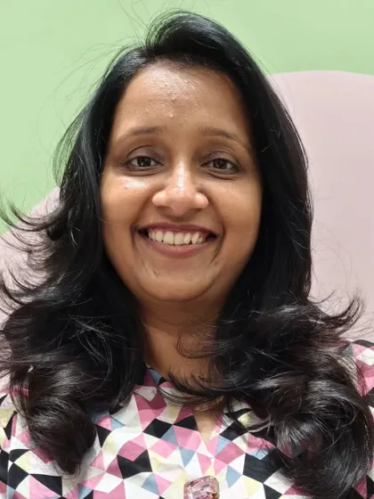 A beautiful smile from a client who loves her new, confidence-boosting haircut.