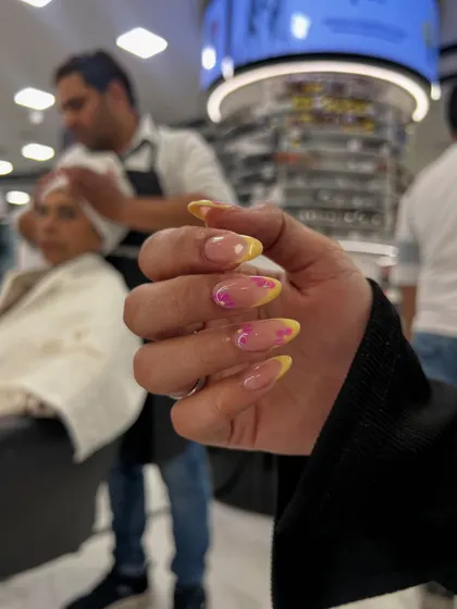 A vibrant and summery airbrush ombré design, blending yellow and pink for a fun, eye-catching look.