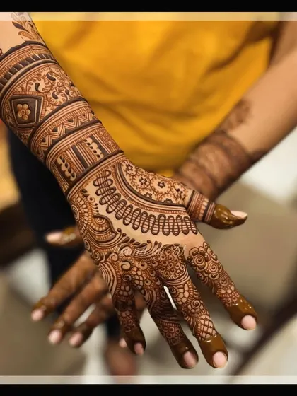 An intricate design with delicate details, perfect for a bride who appreciates fine artistry.
