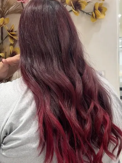 Another look at the vibrant red ombre, highlighting the intensity of the red tones at the ends.