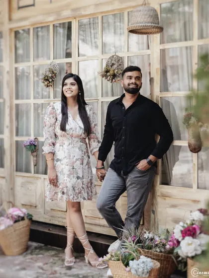 A stylish portrait of a couple in front of a chic cafe. This shot is great for save-the-dates, capturing a modern and fashionable look that is both posed and relaxed.