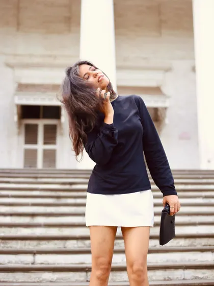 An expressive, windswept pose that adds movement and drama to this chic western look.