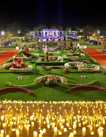 An overview of a heavenly reception layout. I designed the space with floral-patterned lawns and pathways lit by thousands of candles, creating a magical, starlit garden.