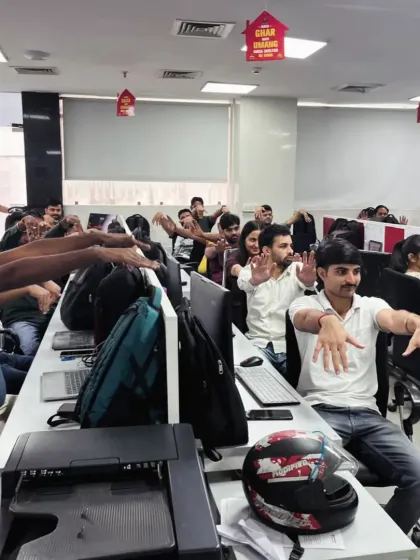 A moment of collective stretching during a busy workday. These simple, guided movements help to break the monotony, increase blood flow, and provide an instant mental and physical reset for your employees, boosting afternoon productivity.