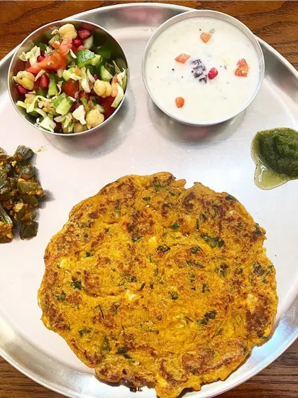 This complete vegetarian thali took me just 45 minutes to put together. It has a paneer and methi roti, okra sabzi, a chopped salad with chickpeas, and a cooling raita. Healthy home cooking doesn't have to be complicated.