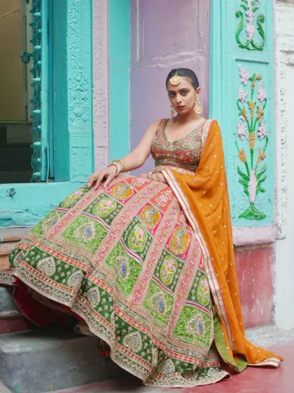 This shot captures the full glory of the multi-colored heritage lehenga. The combination of a mustard yellow dupatta with the vibrant skirt is simply breathtaking.