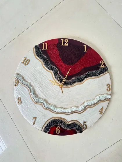 A repeat of the striking red, white, and black geode clock, a popular design choice in our workshops.