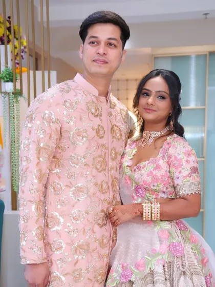 The happy couple on their engagement day. Her makeup was designed to look beautiful from every angle and last through the entire event.