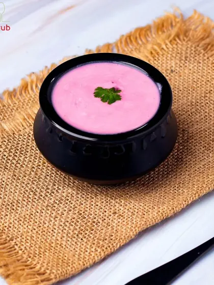 Dive into a burst of color with our delightful Beetroot Raita. The creamy yogurt and earthy sweetness of beets create a unique and refreshing side dish.