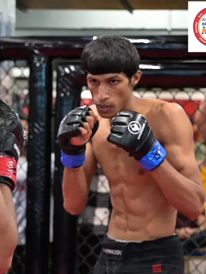 A focused shot of our coach and athlete, Sumanth, during a fight. His intensity and skill are an inspiration to the entire team.