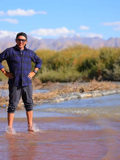 Taking a moment to cool down and recover in a shallow river. This kind of natural cold water therapy is perfect for soothing tired muscles after a long run.