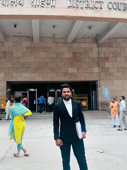 A full-length shot outside the bustling District Court Rohini. This is my daily work environment, where I navigate the legal system for my clients.