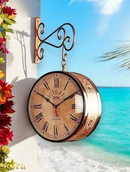 Our dual-sided station clock in a warm copper finish, featuring an aged dial and intricate casing details for a rich, antique look.