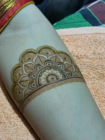 A clean and precise half-mandala arm band, showing the beauty in simplicity.
