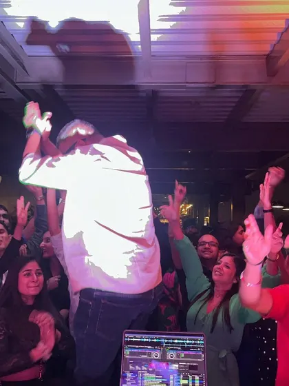 A photo from a recent gig, with the crowd's hands in the air. Pure weekend energy.