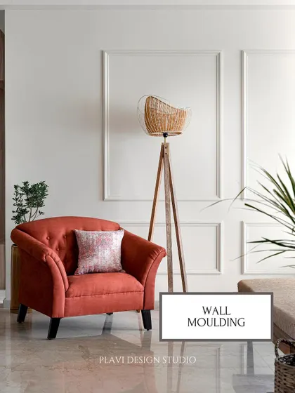 Wall moulding is a classic way to add architectural detail and elegance to a plain wall. It creates a sophisticated backdrop for furniture and art, as seen in this cozy reading corner.