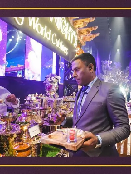 A guest enjoying our offerings at a live station during a glamorous event, demonstrating the appeal and quality of our food in a corporate setting.