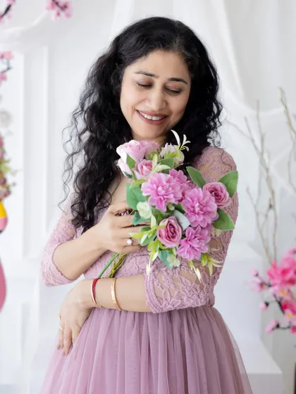A mother's gentle smile. Our goal is to make everyone feel beautiful and celebrated, capturing the love that shapes a family.
