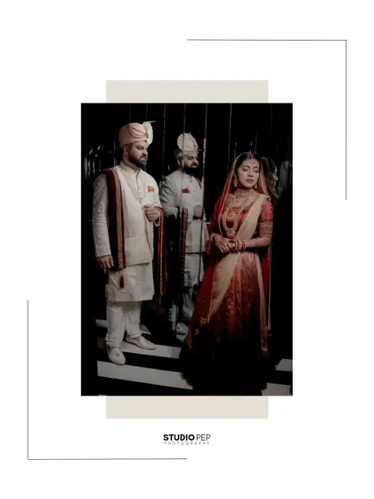 An artistic shot of the couple, their reflection captured in a mirror, creating a moody and sophisticated portrait.