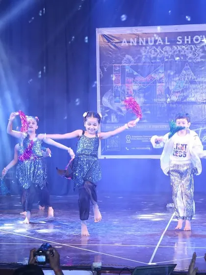 Using colorful props, our youngest dancers create a beautiful and vibrant stage picture.