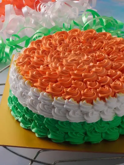 Express your patriotism with our Tiranga Cake for Republic Day. This Dutch Truffle cake is decorated with beautiful orange, white, and green frosting rosettes, representing the Indian flag.